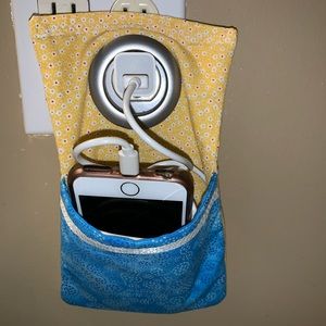 blue and yellow phone/charger holder
